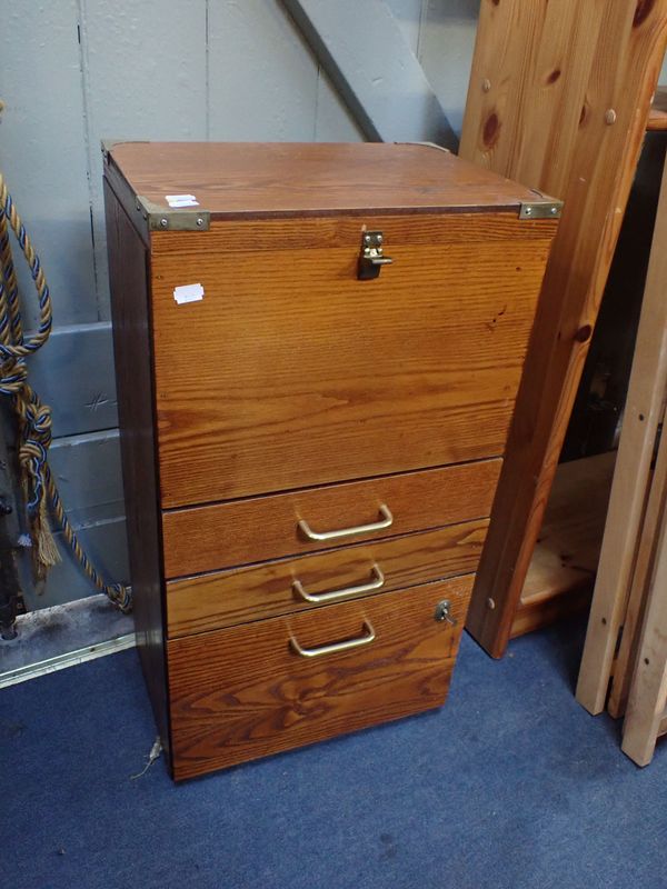 A WOODEN TOOL CHEST OR FILING CABINET