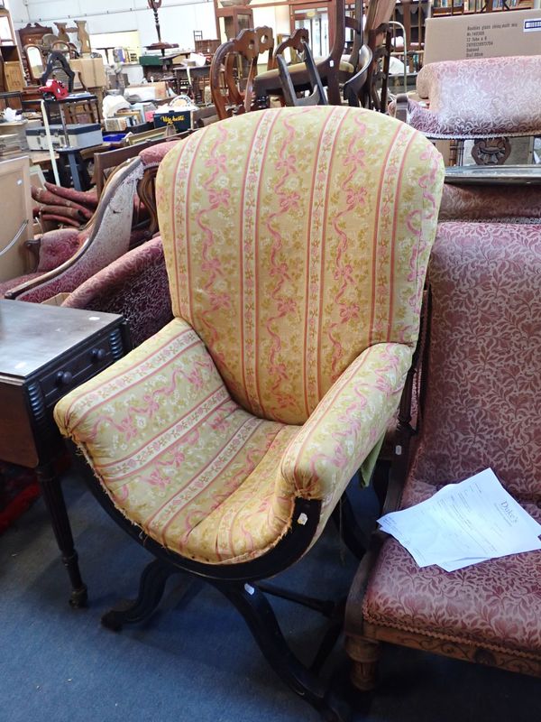 AN 'X' FRAME  UPHOLSTERED CHAIR