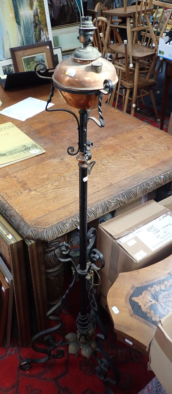 A VICTORIAN WROUGHT IRON AND COPPER STANDARD LAMP