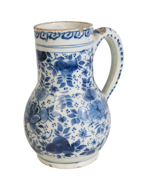 A DELFT BLUE AND WHITE PEAR SHAPED TANKARD