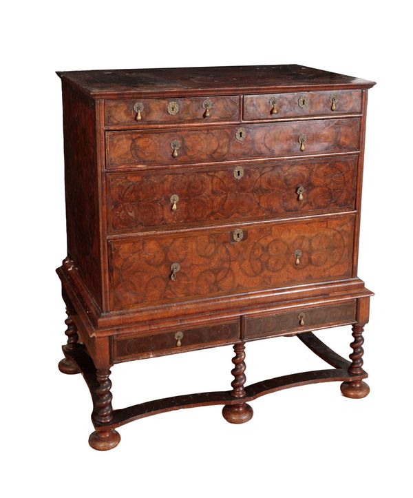 A WILLIAM AND MARY OYSTER VENEERED CHEST ON STAND