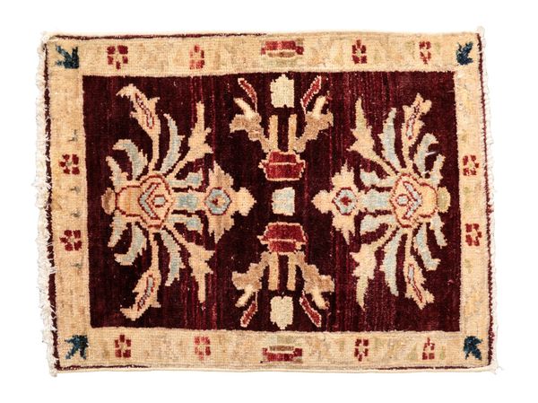 A SMALL PERSIAN STYLE RUG