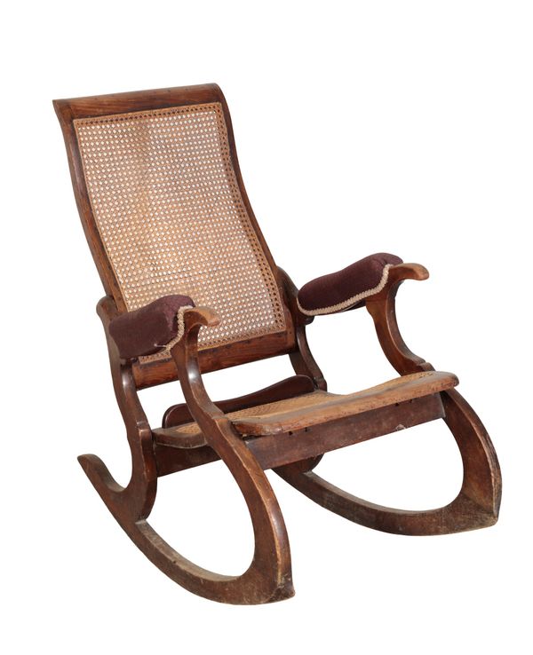 A MAHOGANY BERGERE ROCKING CHAIR