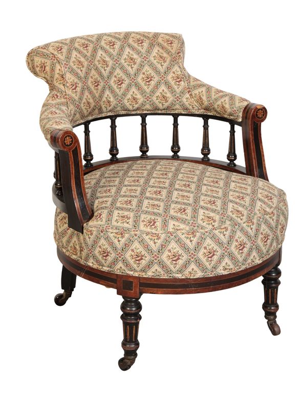 A VICTORIAN WALNUT AND EBONY UPHOLSTERED ARMCHAIR