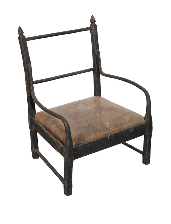 AN IRON CHILDS ARMCHAIR