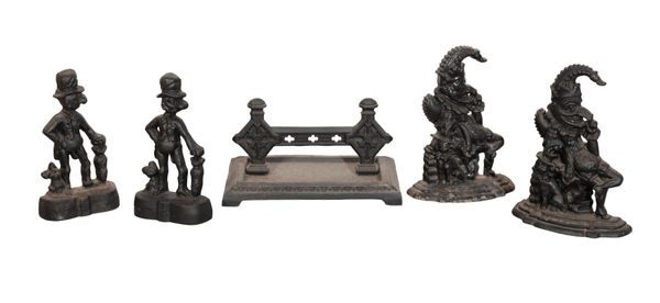 A SET OF FOUR VICTORIAN PUNCH CAST IRON DOOR STOPS