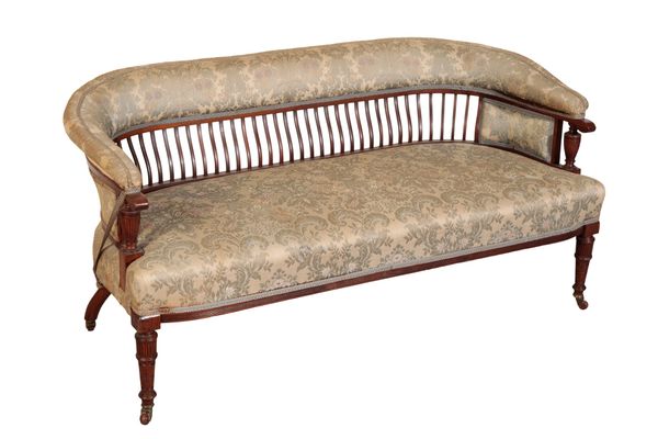 AN EDWARDIAN UPHOLSTERED LOW SETTEE