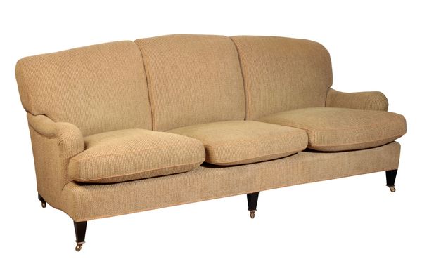 A HOWARD AND SONS THREE-SEATER SOFA