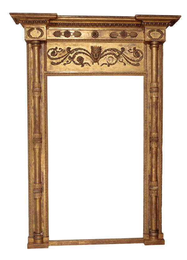 A REGENCY GILTWOOD AND COMPOSITION OVERMANTEL MIRROR,