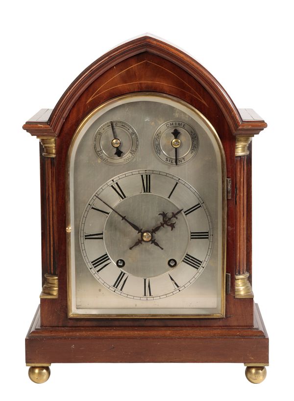 AN EDWARDIAN MAHOGANY BRACKET CLOCK