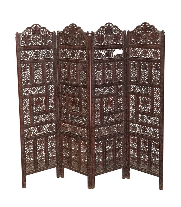 AN ANGLO INDIAN CARVED WOOD FOUR FOLD SCREEN