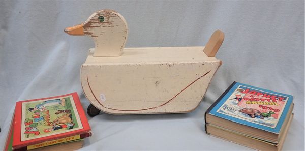 A CHILD'S WOODEN TOY DUCK