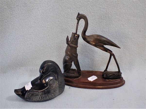 A CARVED ASIAN STATUE OF DOG AND A CRANE