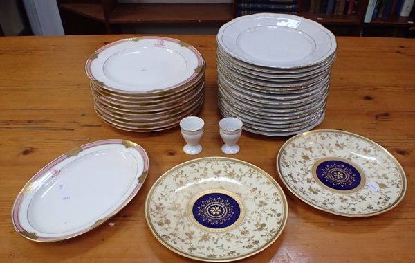 A QUANTITY OF MINTON GOLD AND PINK PLATES, WITH CREST