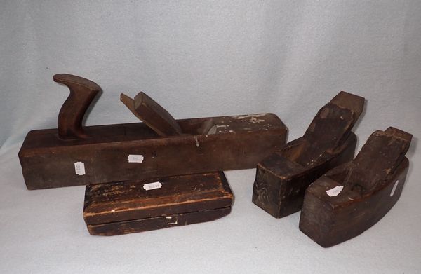 THREE VINTAGE WOODEN WOOD PLANES AND A WHETSTONE