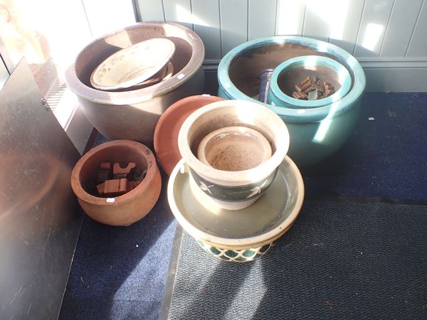 A COLLECTION OF TURQUOISE AND TERRACOTTA PLANTERS