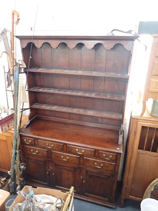 A REPRODUCTION GEORGE III STYLE OAK DRESSER