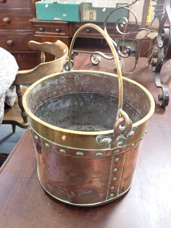 A COPPER AND BRASS BUCKET