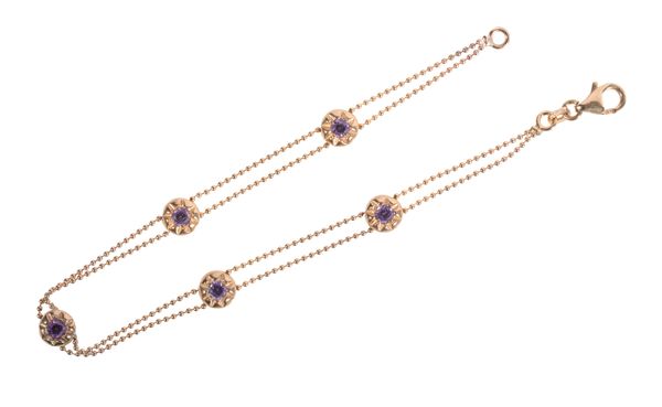 AN AMETHYST AND GOLD BRACELET