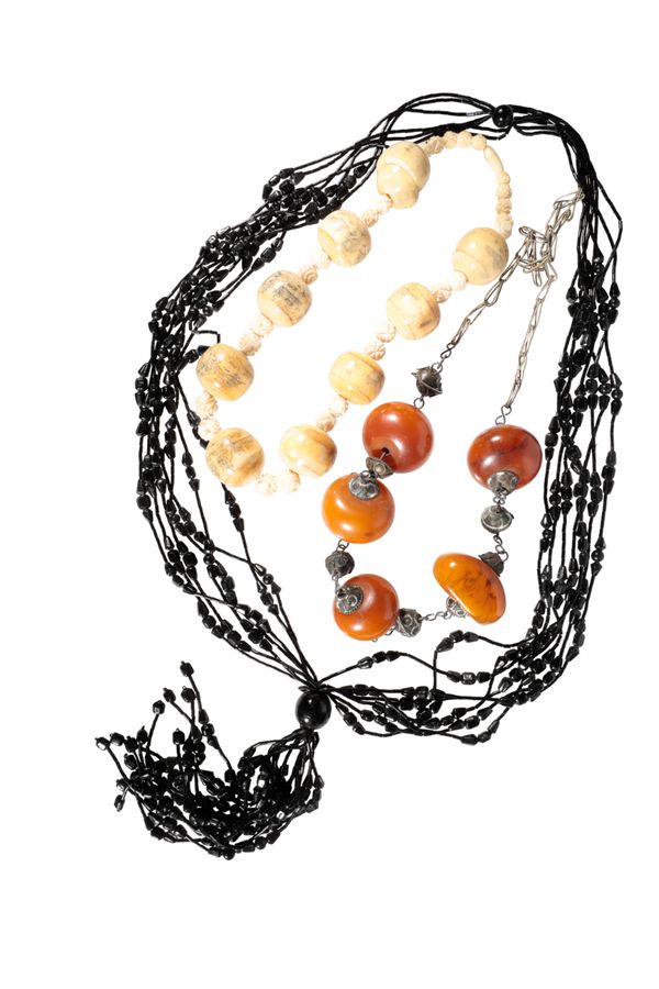 A COLLECTION OF "AMBER" TYPE NECKLACES