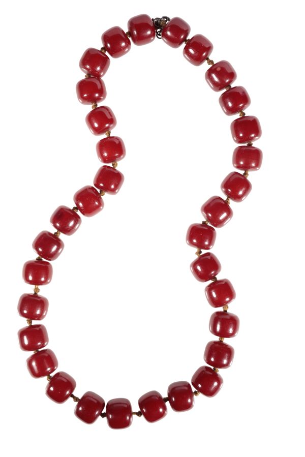 A CHERRY AMBER BEAD NECKLACE