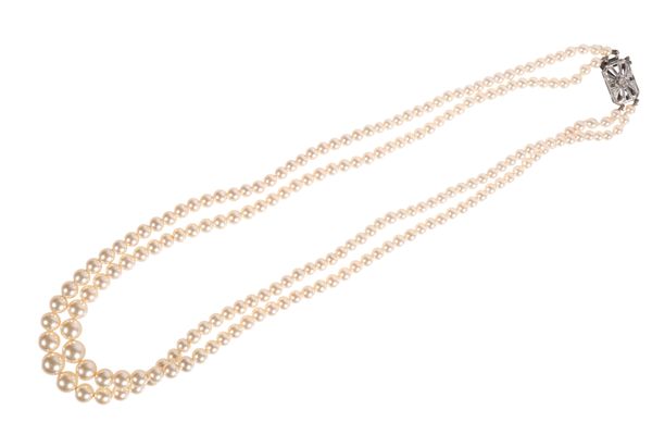 A DOUBLE STRAND GRADUATED  SIMULATED PEARL NECKLACE