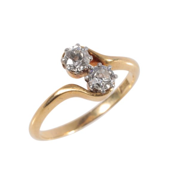 A TWO STONE CROSSOVER DIAMOND RING