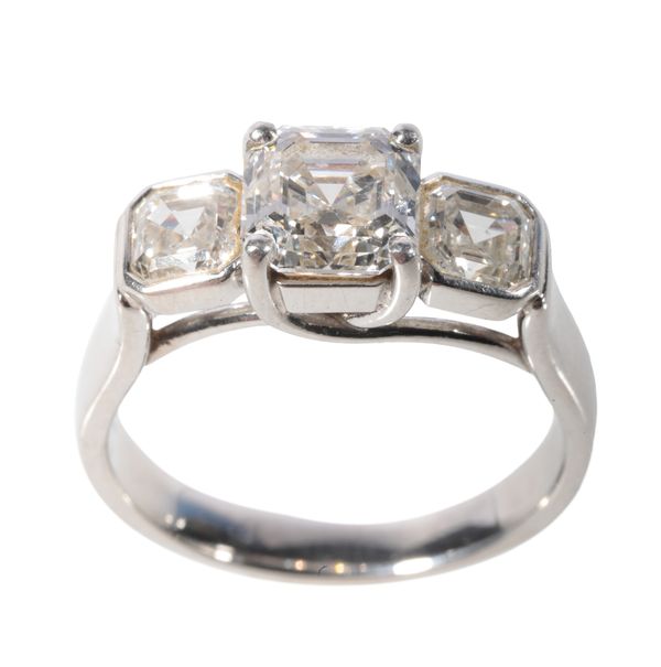 A THREE STONE DIAMOND RING