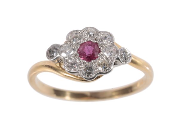 A RUBY AND DIAMOND DAISY CLUSTER RING RETURNED DD