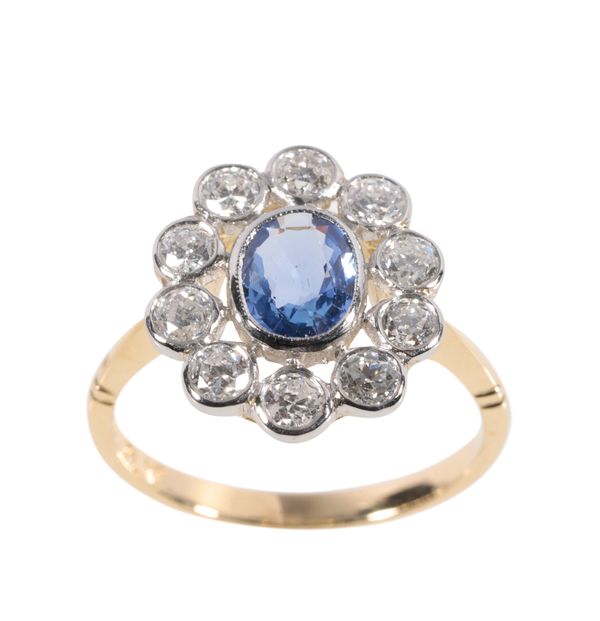 A SAPPHIRE AND DIAMOND CLUSTER RING