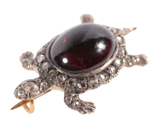 A DIAMOND AND GARNET TURTLE BROOCH