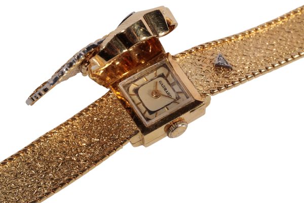 GARRARD: AN 18CT GOLD LADY'S BRACELET WATCH