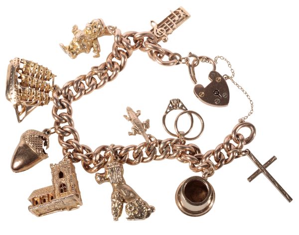 A 9CT GOLD CHARM BRACELET