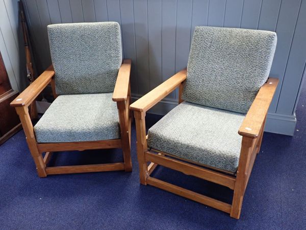 A PAIR OF LIGHT OAK COTSWOLD STYLE ARMCHAIRS