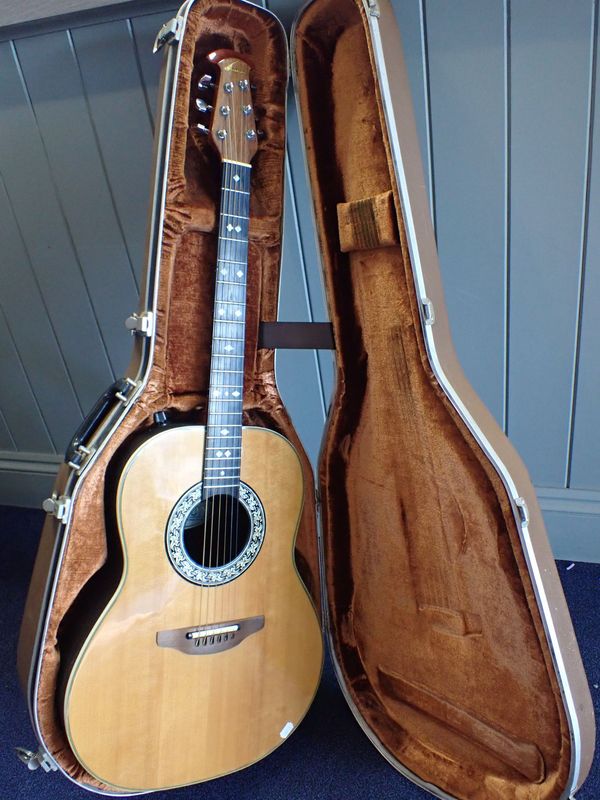 A 1982 OVATION GUITAR, SERIAL NO. 273491