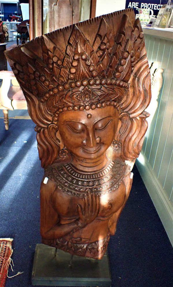 A SUBSTANTIAL ASIAN TEAK CARVING OF A CROWNED FEMALE