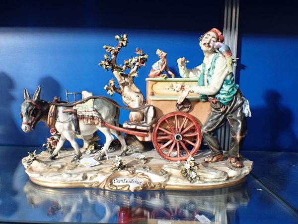 A LARGE CAPODIMONTE FIGURE: 'CANTASTORIE', AN ORGAN GRINDER