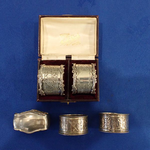 A CASED PAIR OF SILVER NAPKIN RINGS