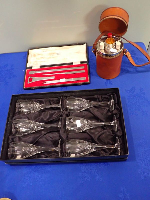 THREE SILVER PLATED HIP FLASKS AND CUPS CONTAINED IN A LEATHER CASE