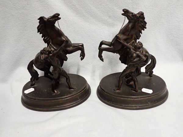 A PAIR OF BRONZED SPELTER 'MARLY' HORSES