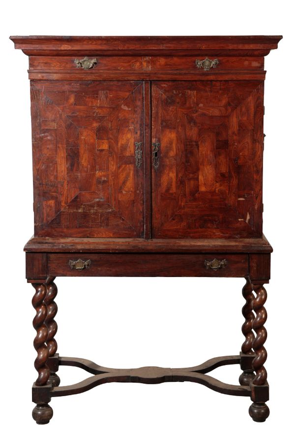 AN OYSTER-VENEERED WALNUT AND PRINCESWOOD CHEST-ON-STAND