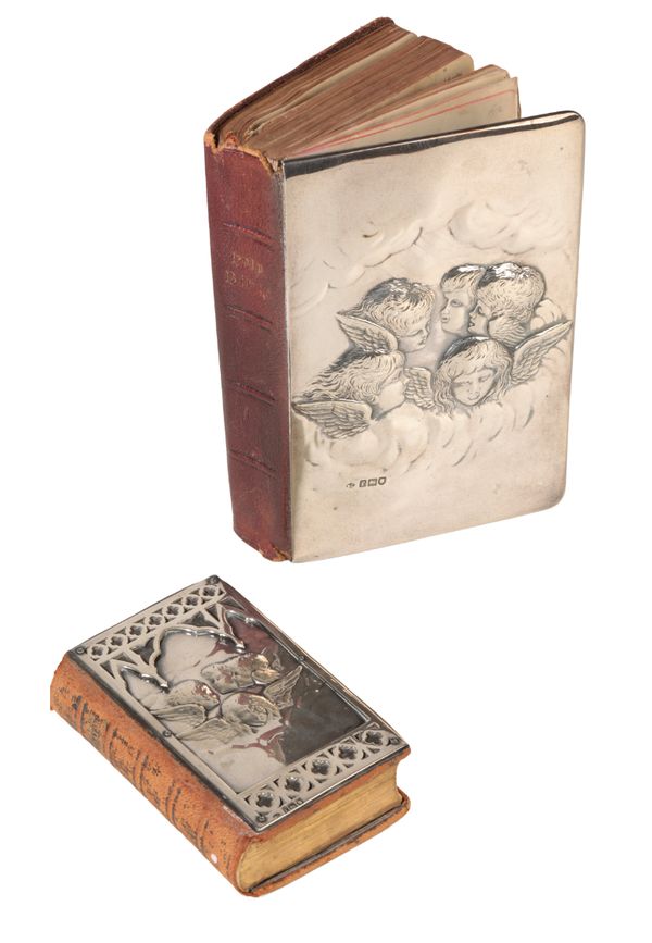 AN EARLY 20TH CENTURY BIBLE WITH SILVER COVER,