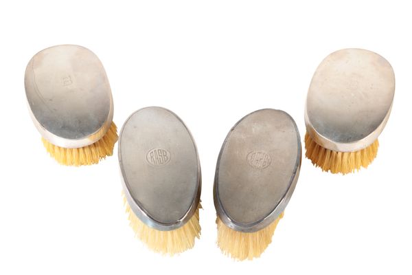 A SET OF FOUR GEORGE V MATCHED SILVER DRESSING BRUSHES