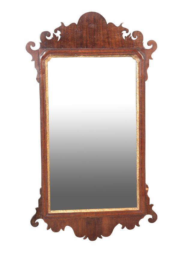 A GEORGE II MAHOGANY AND PARCEL-GILT MIRROR