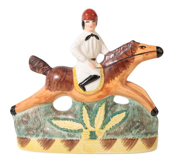 A STAFFORDSHIRE FLATBACK FIGURE OF A JOCKEY