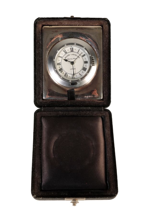 A SILVER CASED TRAVELLING CLOCK,