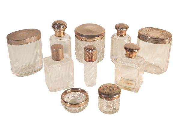 A COLLECTION OF SILVER LIDDED DRESSING-TABLE JARS