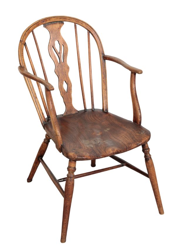 A PRIMITIVE ELM ELBOW CHAIR