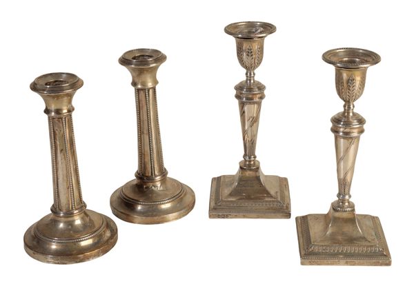 A PAIR OF SILVER CANDLESTICKS