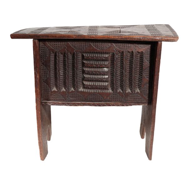 A WEST AFRICAN CARVED CEREMONIAL STOOL